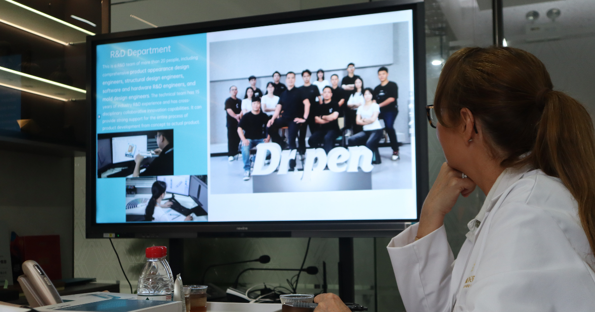 Owner of Pure Derma London reviewing the Dr. Pen factory R&D team and production department during the May 2026 site visit