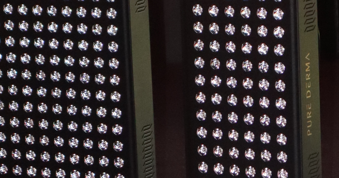 Close-up of LEDs on a Pure Derma LuminAGE LED light therapy panel, showing individual LED lenses in rows.