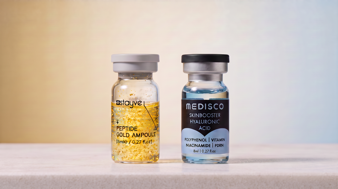 Stayve EGF Peptide Gold and Medisco Hyaluronic Acid skin booster ampoules standing side by side on a white stone surface against a soft gold to blue gradient background