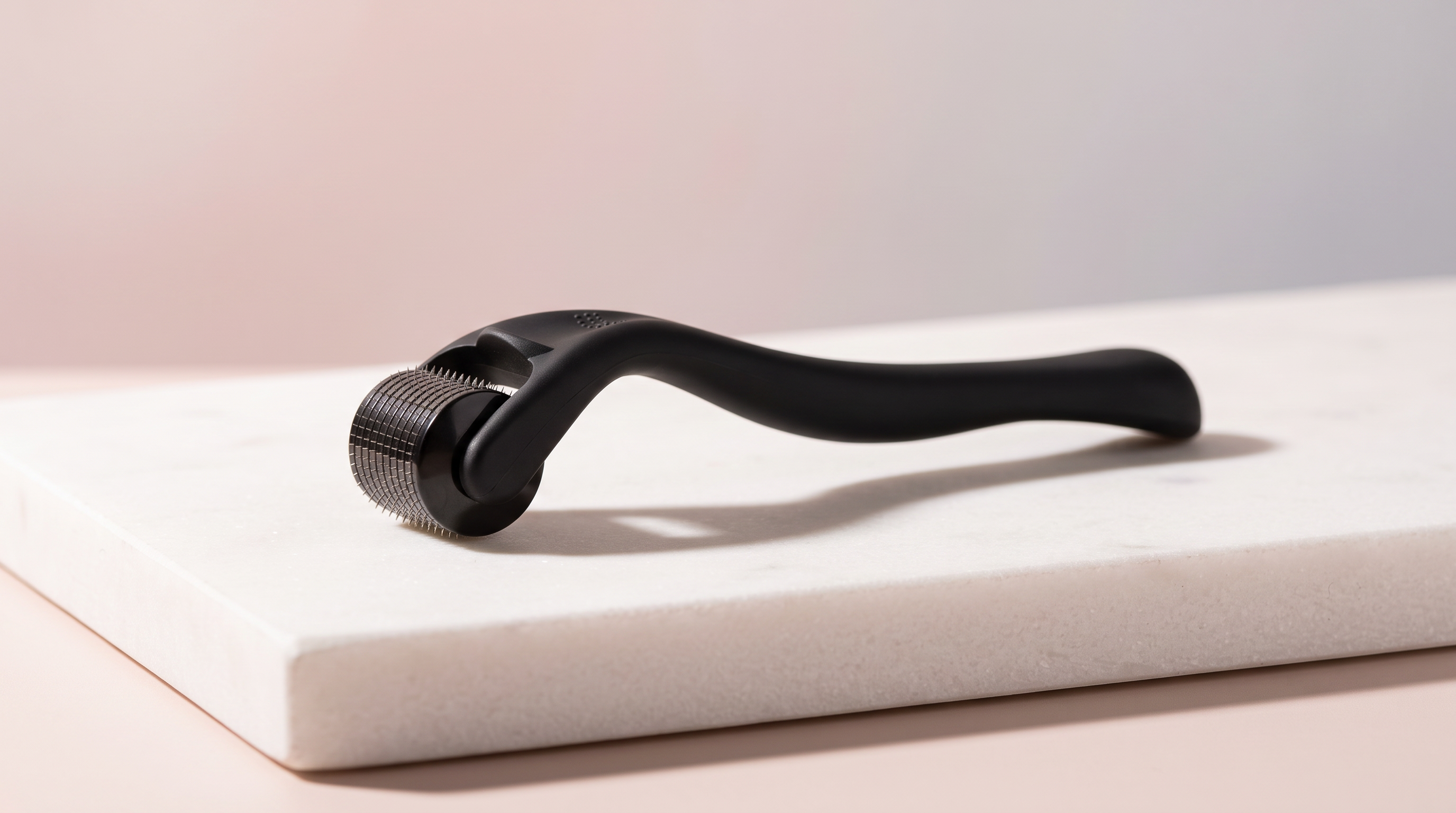 The Pure Derma Hair & Beard Derma Roller with 540 titanium microneedles, used for at home scalp microneedling and hair growth.