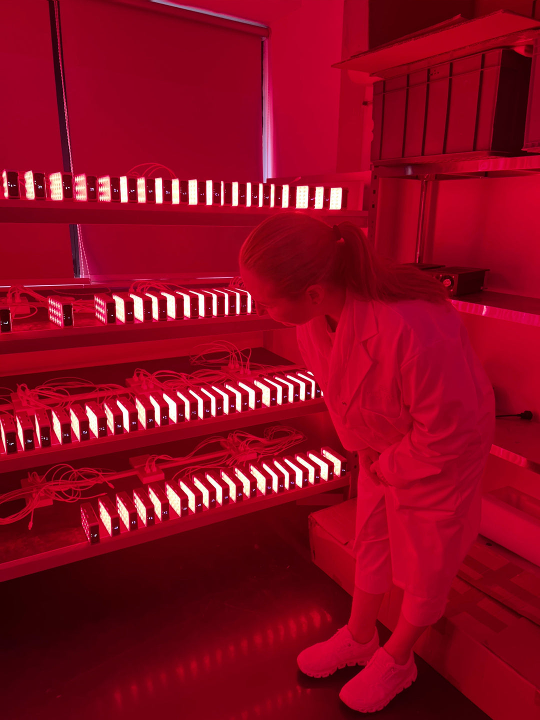 Owner of Pure Derma inspecting LED devices