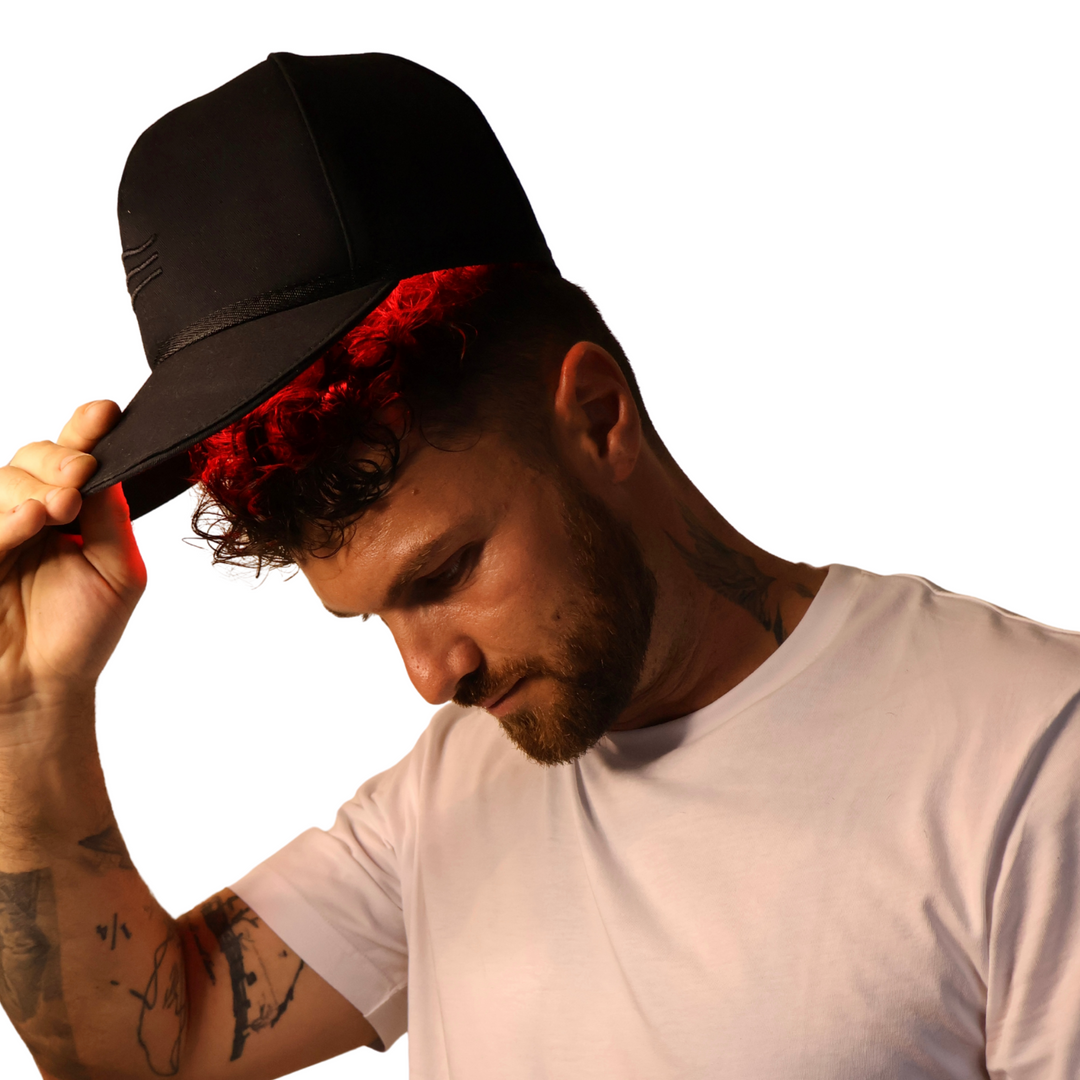 male wearing Pure Derma London LED red light hair growth cap with high irradiance