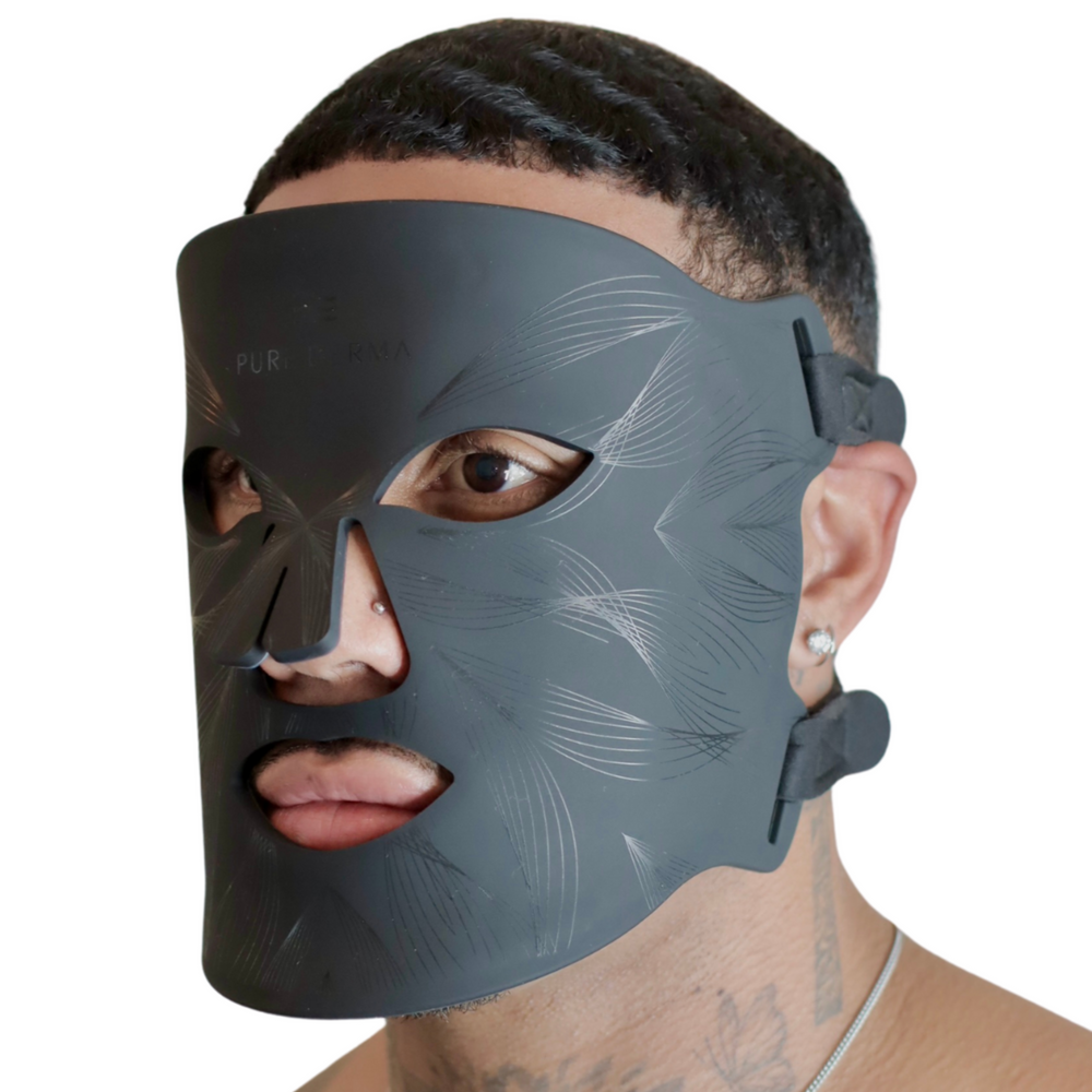 male model wearing Pure Derma London black LED light therapy face mask