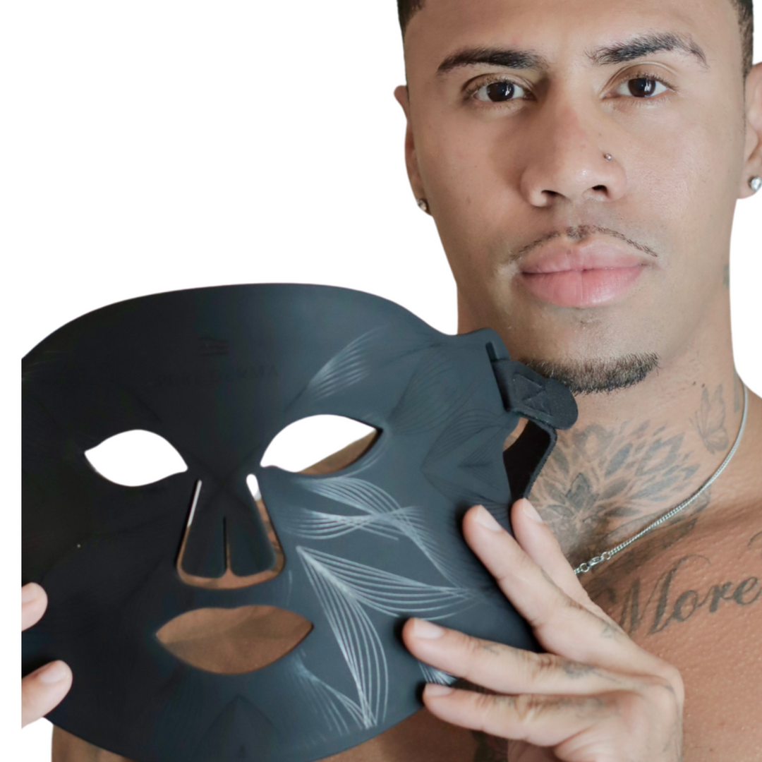 male model holding Pure Derma London black LED face mask