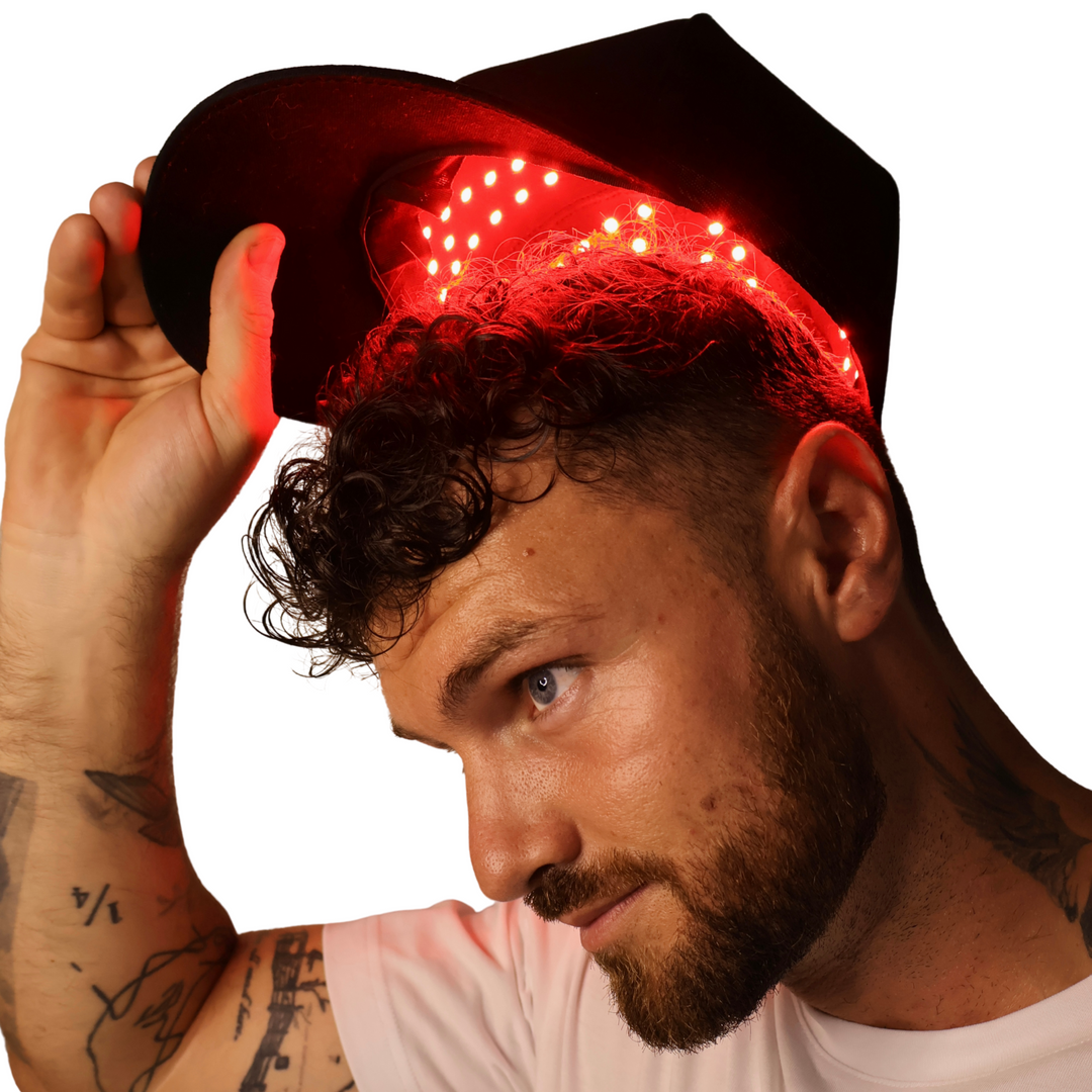 male wearing Pure Derma London LED red light hair growth cap